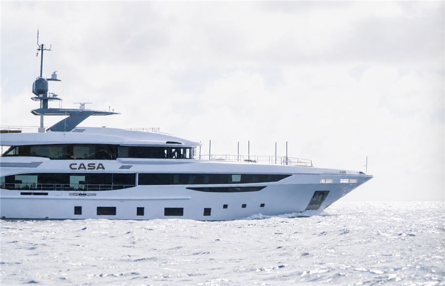 The CASA mega yacht in profile at sea in morning mist, carrying the new wordmark